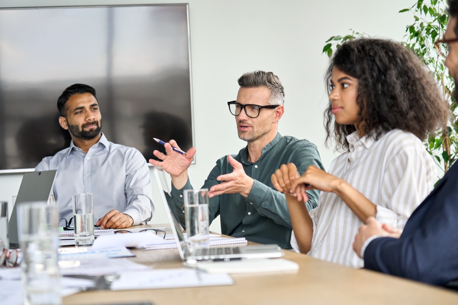 A leadership development session discussing resilience around a meeting table